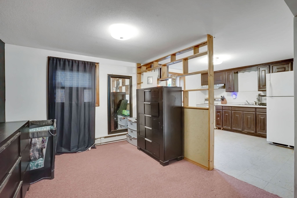 290 Newton Road Springfield, MA 01118 - Photo 25 of 38 a kitchen with refrigerator and window