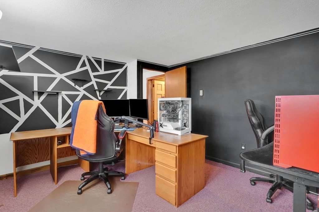 290 Newton Road Springfield, MA 01118 - Photo 28 of 38 a view of a workspace with furniture and a window