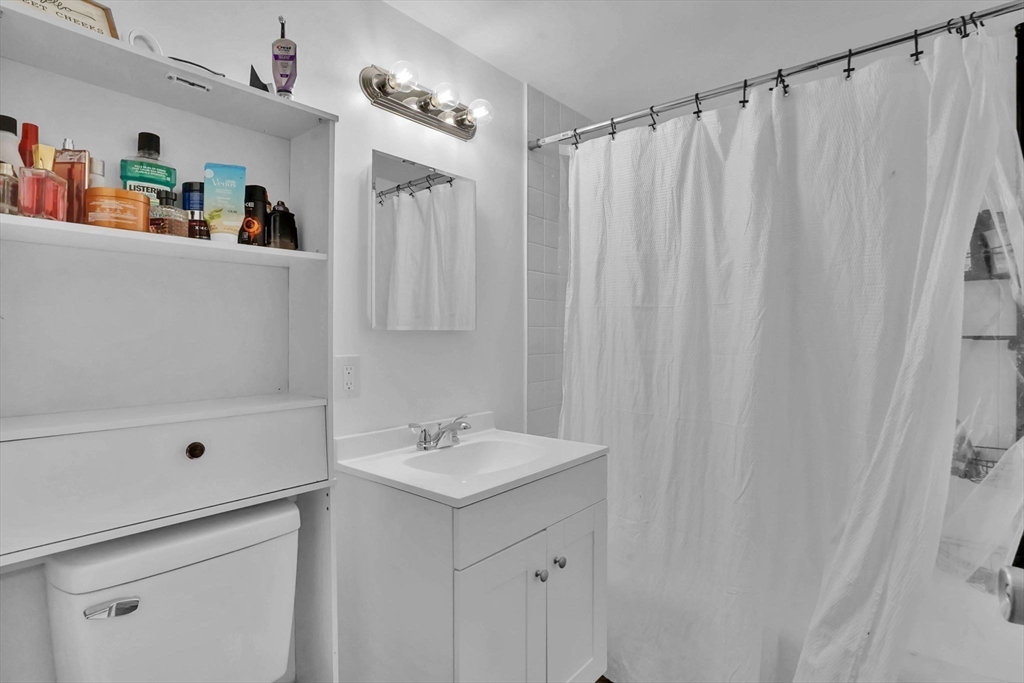 290 Newton Road Springfield, MA 01118 - Photo 29 of 38 a bathroom with a shower and a sink