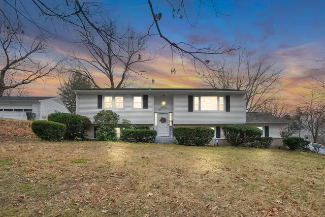 a front view of a house with a yard