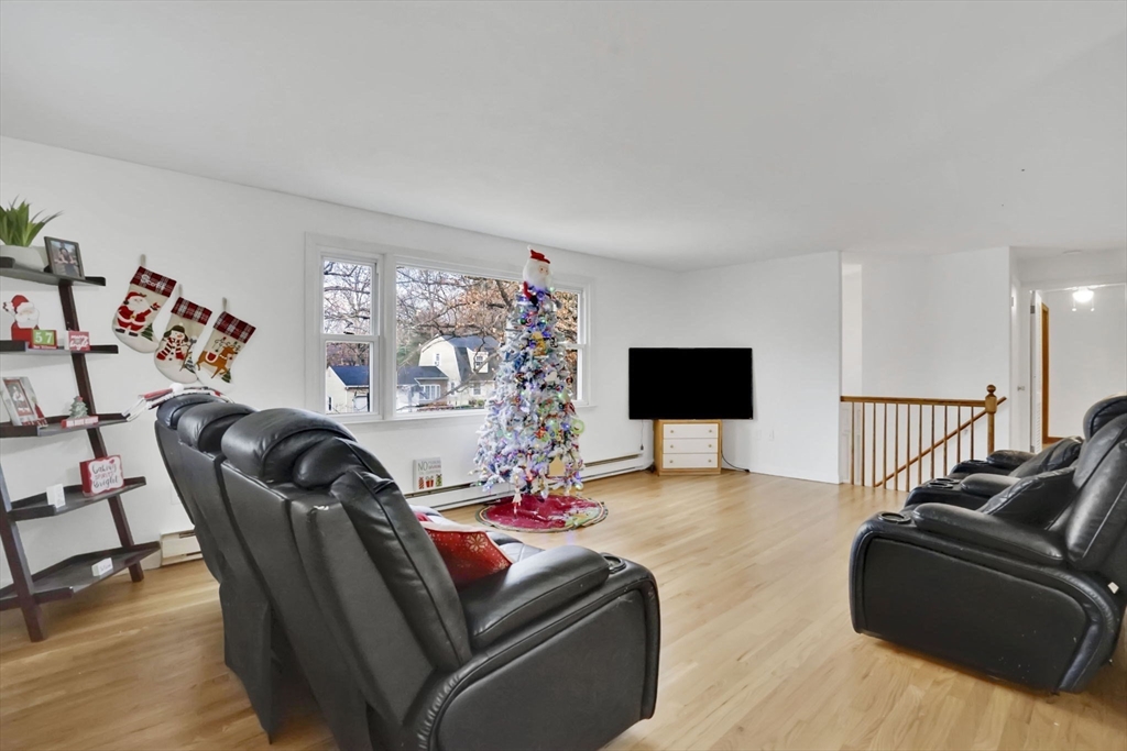 290 Newton Road Springfield, MA 01118 - Photo 6 of 38 a living room with furniture and a flat screen tv