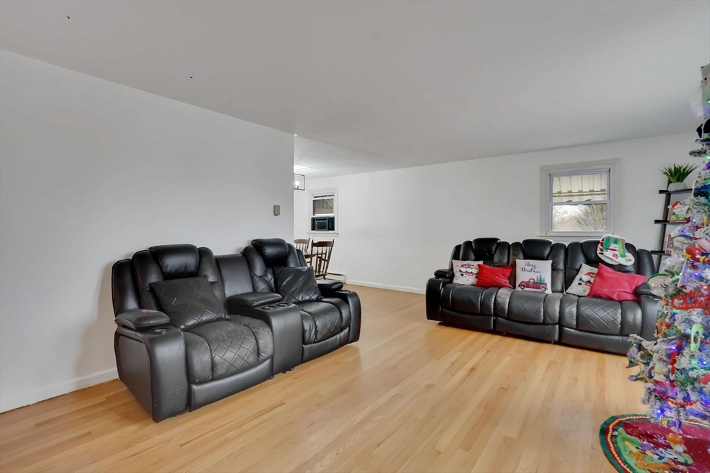 290 Newton Road Springfield, MA 01118 - Photo 8 of 38 a living room with furniture and a wooden floor