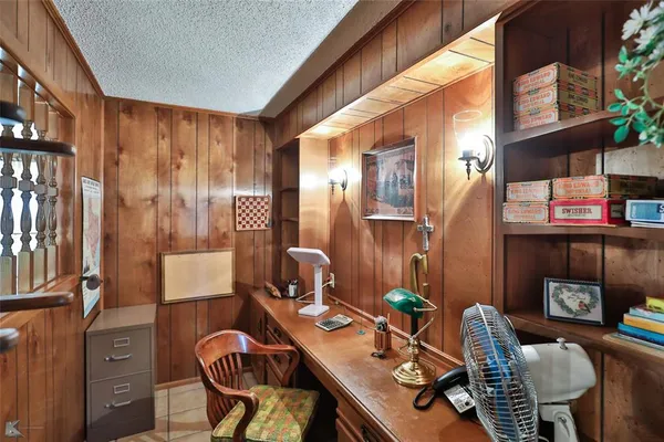 a living room with furniture a ceiling fan and a window