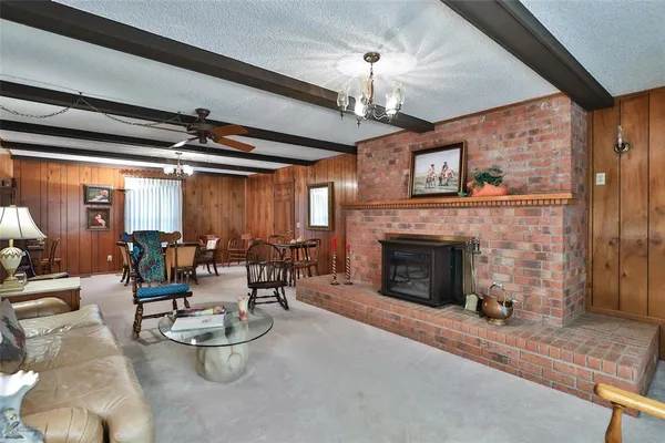 a view of a livingroom with furniture and staircase