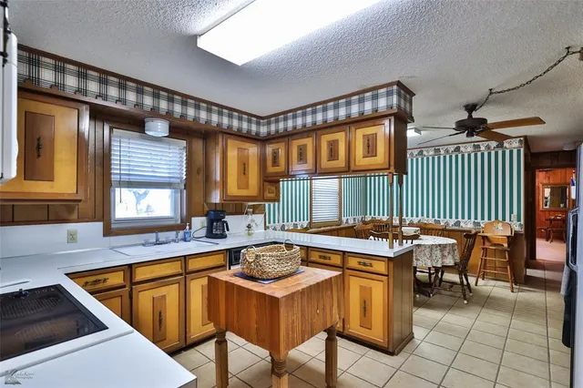 a kitchen that has a stove and a refrigerator