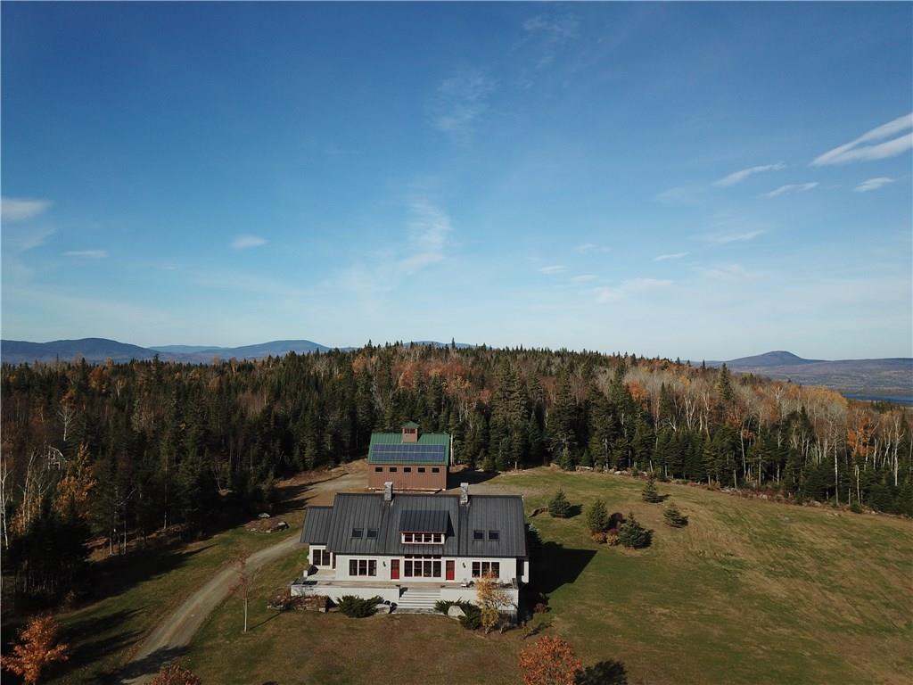 332 City Pond Road Dallas Plt, ME 04970 - Photo 17 of 32 Main house with the garage in the...