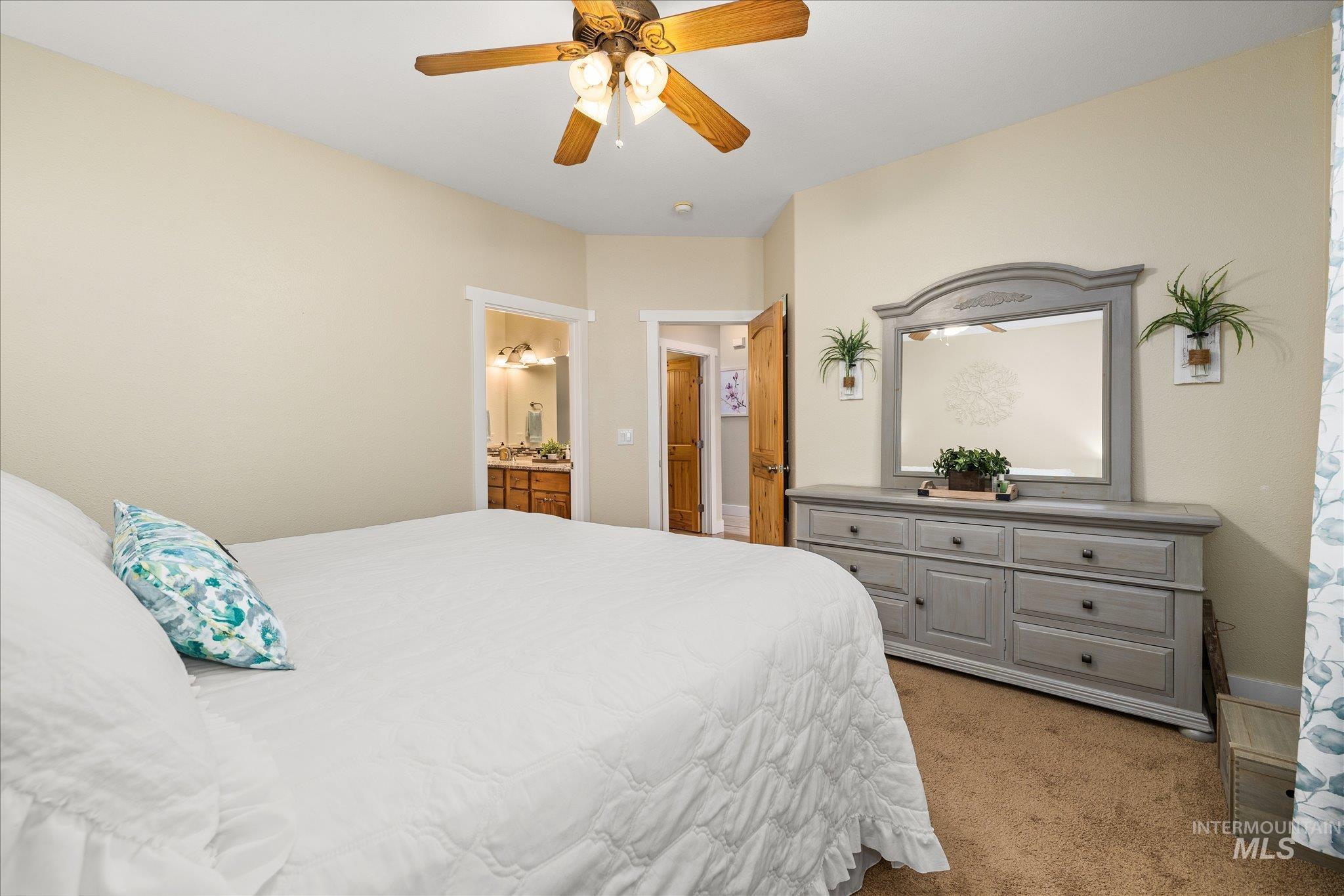 1140 Edgemont Road Emmett, ID 83617 - Photo 16 of 50 Carpeted room with a wooden ceiling fan and light fixture