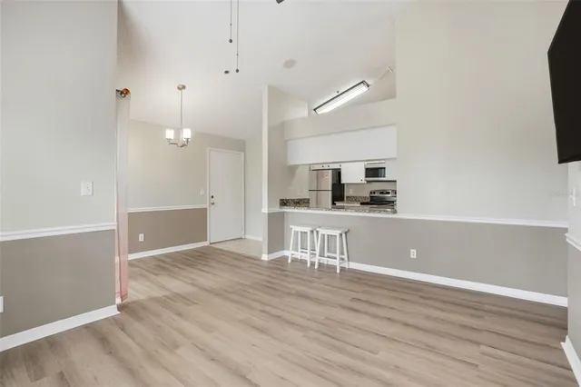 a view of a kitchen cabinets and wooden floor