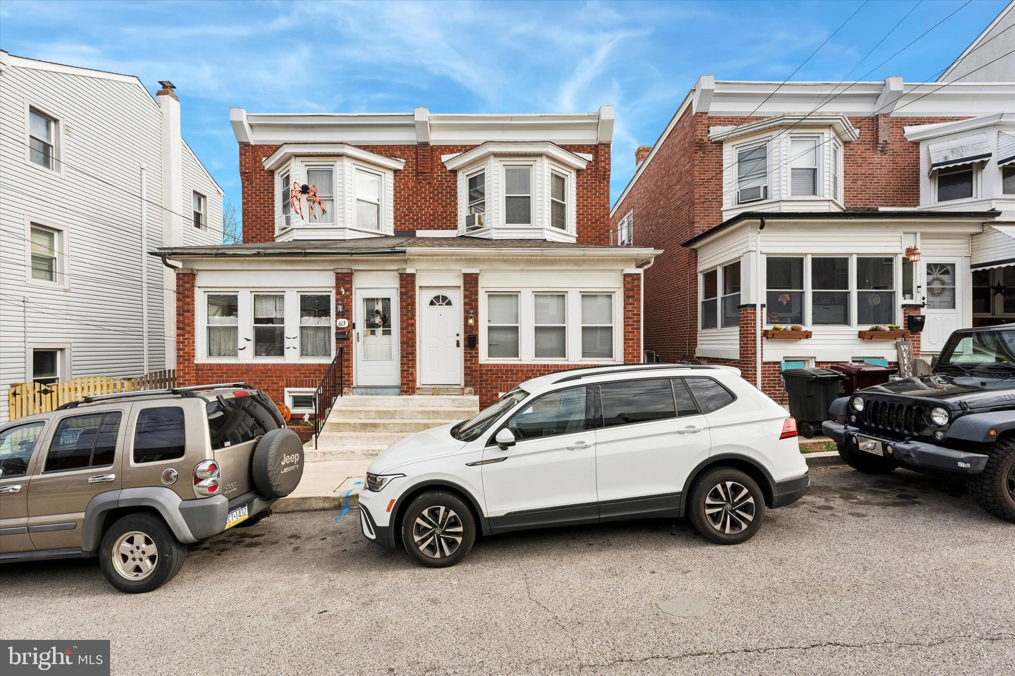 a car parked in front of a house