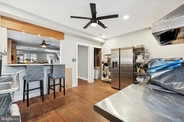 a view of a livingroom with furniture and a kitchen