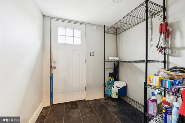 a view of an entryway with wooden floor