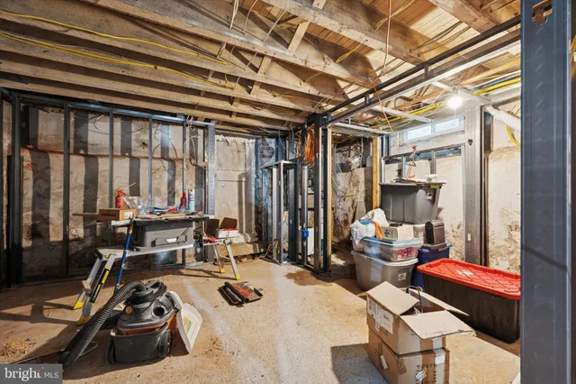 a room with gym equipment and a large window