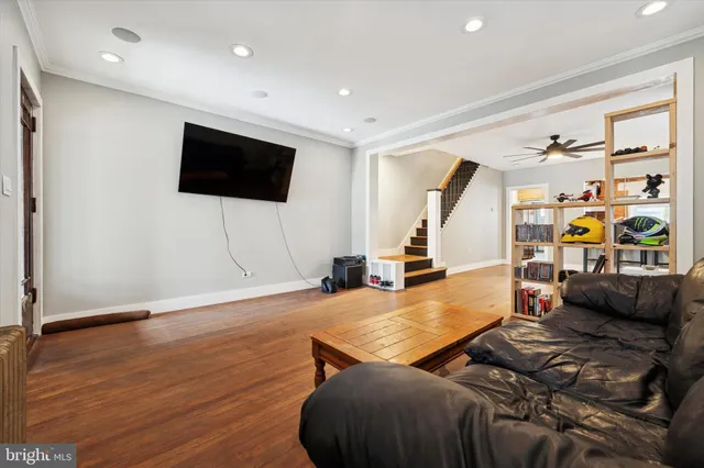 a living room with furniture and a flat screen tv