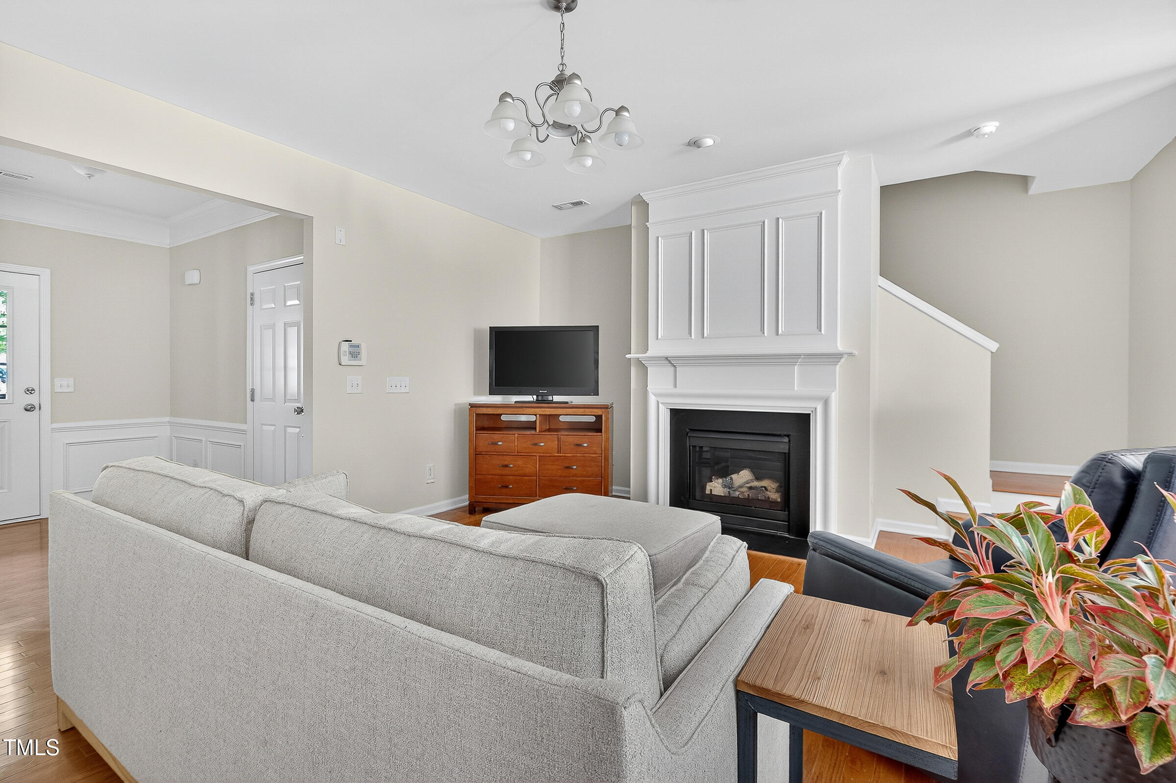 7130 Racine Way Raleigh, NC 27615 - Photo 3 of 19 a living room with furniture and a fireplace