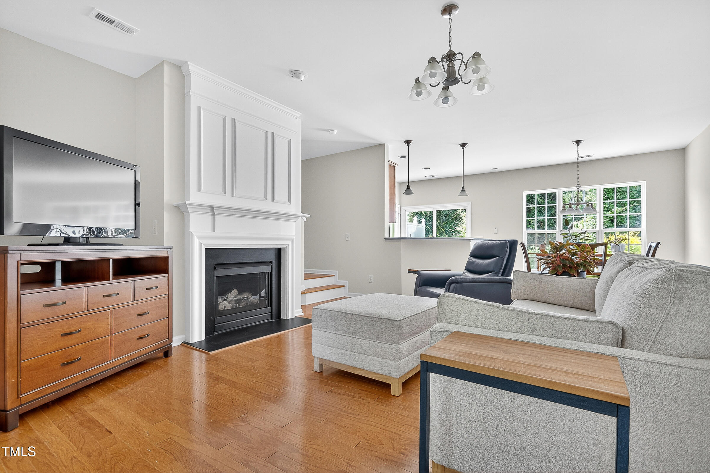 7130 Racine Way Raleigh, NC 27615 - Photo 4 of 19 a living room with furniture and a fireplace