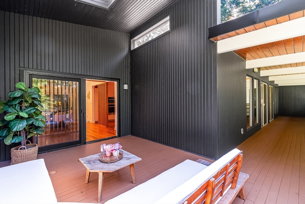 53 Beaver Road Weston, MA 02493 - Photo 15 of 42 a living room with furniture and a potted plant