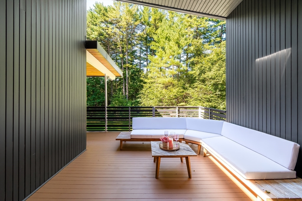 53 Beaver Road Weston, MA 02493 - Photo 16 of 42 a balcony with wooden floor table and chairs