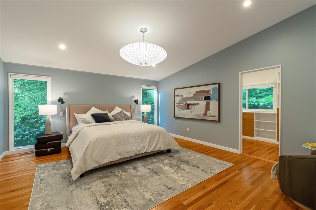 53 Beaver Road Weston, MA 02493 - Photo 17 of 42 a spacious bedroom with a bed and a large window