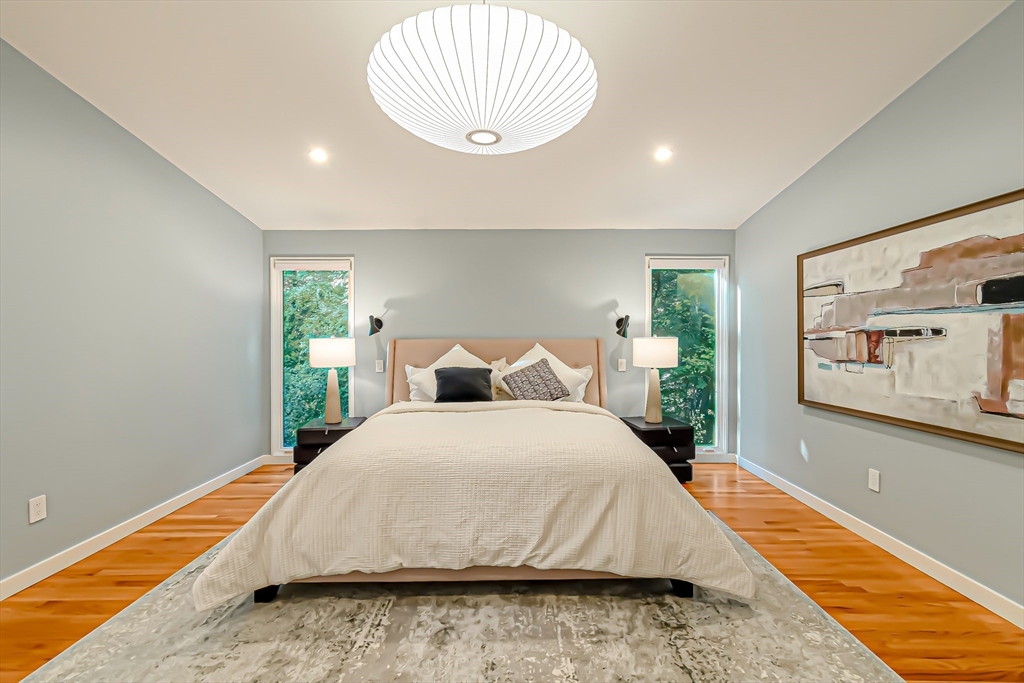 53 Beaver Road Weston, MA 02493 - Photo 18 of 42 a bedroom with a bed and a large window