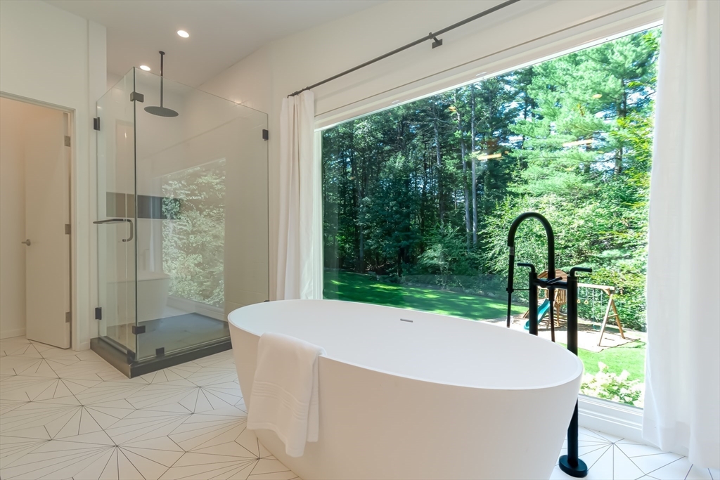 53 Beaver Road Weston, MA 02493 - Photo 20 of 42 a bathroom with a sink bathtub and shower