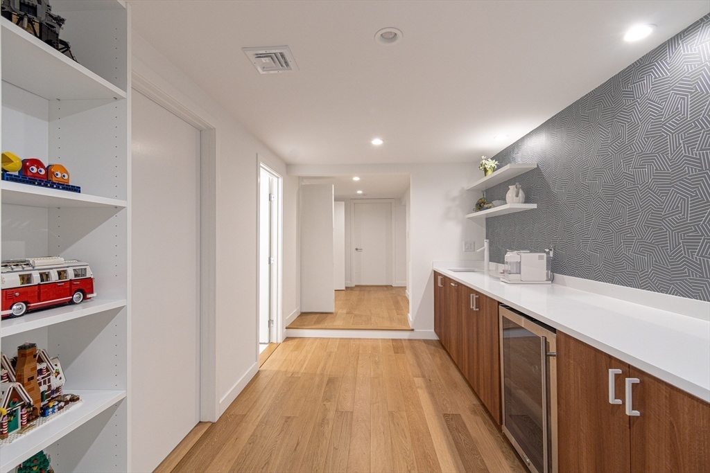 53 Beaver Road Weston, MA 02493 - Photo 30 of 42 a view of a kitchen with a hallway and wooden floor