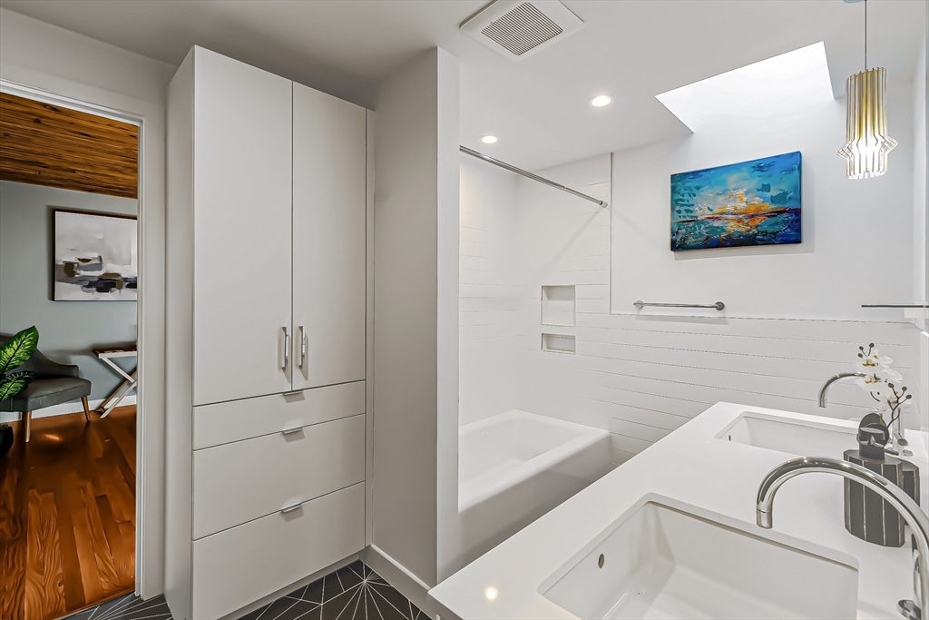 53 Beaver Road Weston, MA 02493 - Photo 31 of 42 a bathroom with a sink and a bathtub