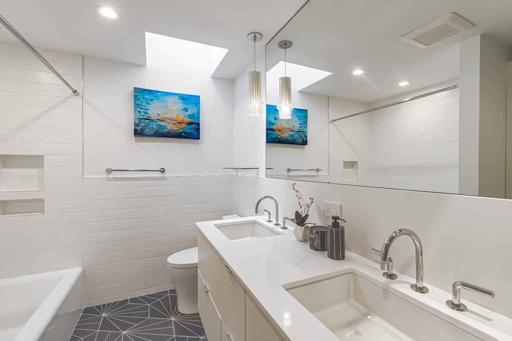 53 Beaver Road Weston, MA 02493 - Photo 32 of 42 a bathroom with a sink mirror and toilet