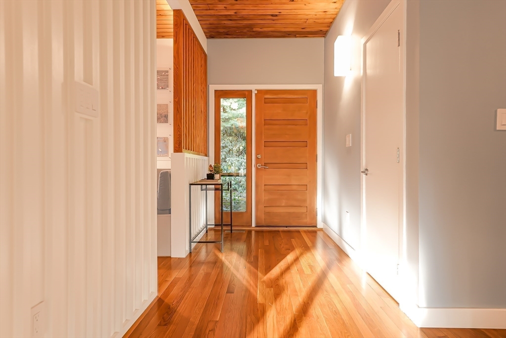 53 Beaver Road Weston, MA 02493 - Photo 33 of 42 a view of a bedroom with wooden floor and a window
