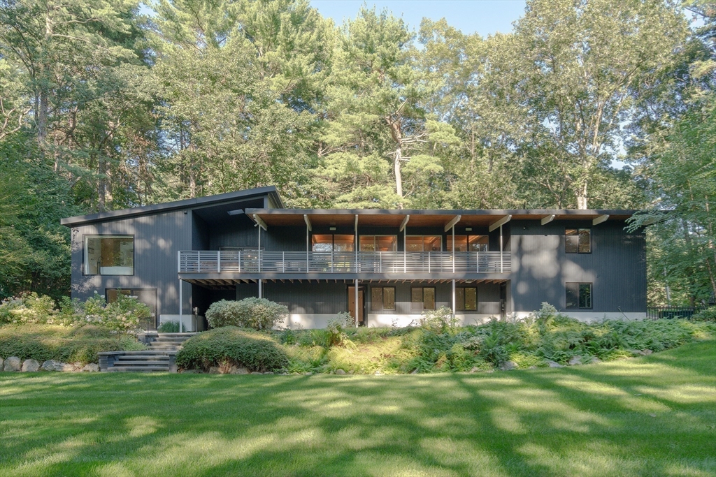 53 Beaver Road Weston, MA 02493 - Photo 37 of 42 a view of a house with a yard and sitting area