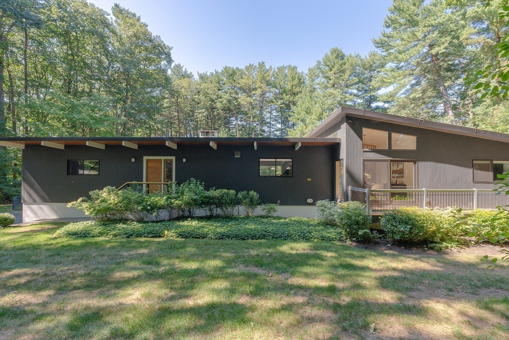 53 Beaver Road Weston, MA 02493 - Photo 39 of 42 a view of a house with yard and a garden