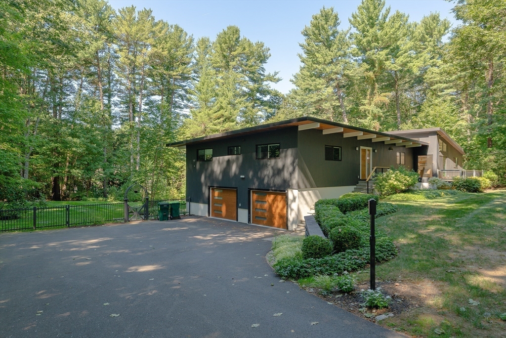 53 Beaver Road Weston, MA 02493 - Photo 40 of 42 a front view of a house with garden