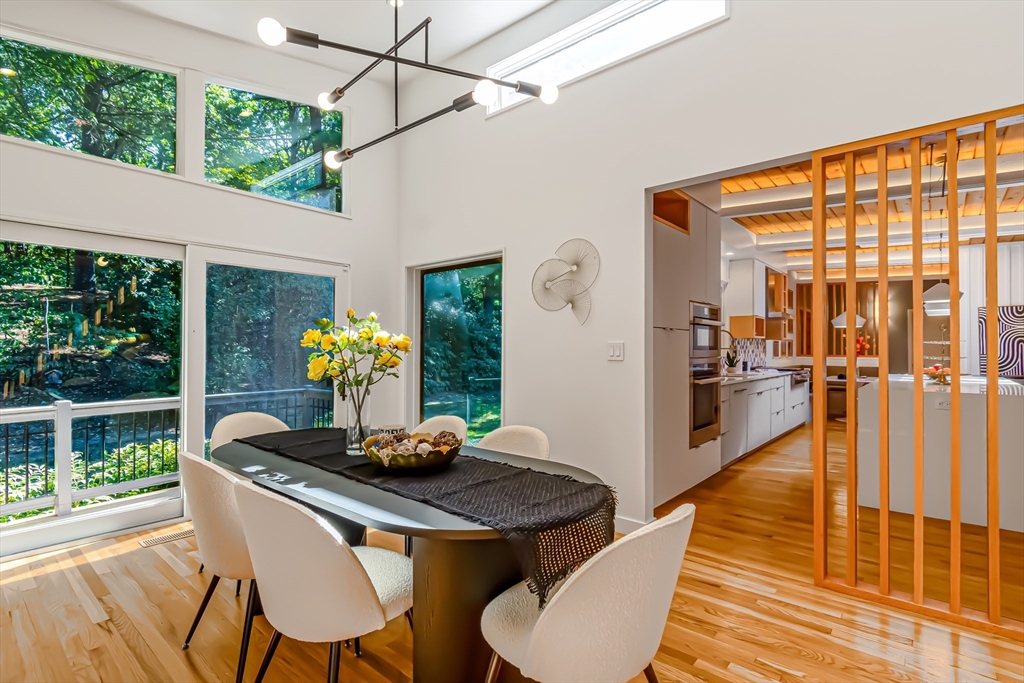53 Beaver Road Weston, MA 02493 - Photo 9 of 42 a dining room with furniture and wooden floor