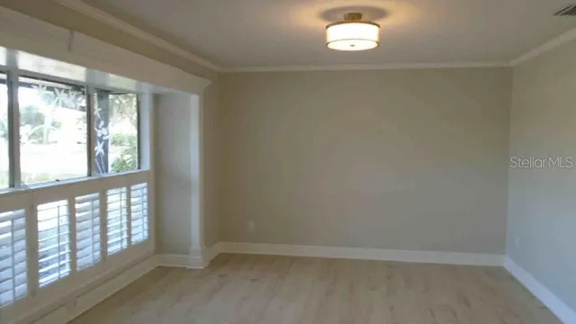 a view of an empty room with a window