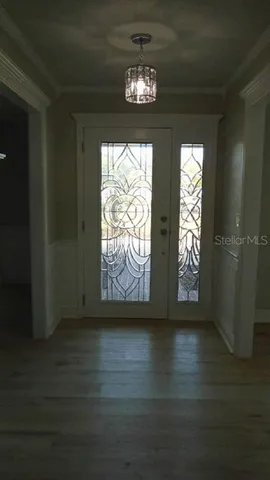 a view of entryway with wooden floor