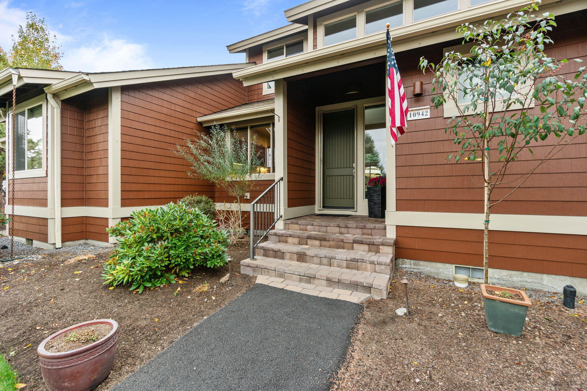 10942 Village Loop Redmond, OR 97756 - Photo 36 of 45 a front view of a house with a garage