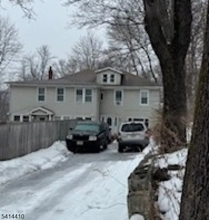 a view of a car parked in front of a house