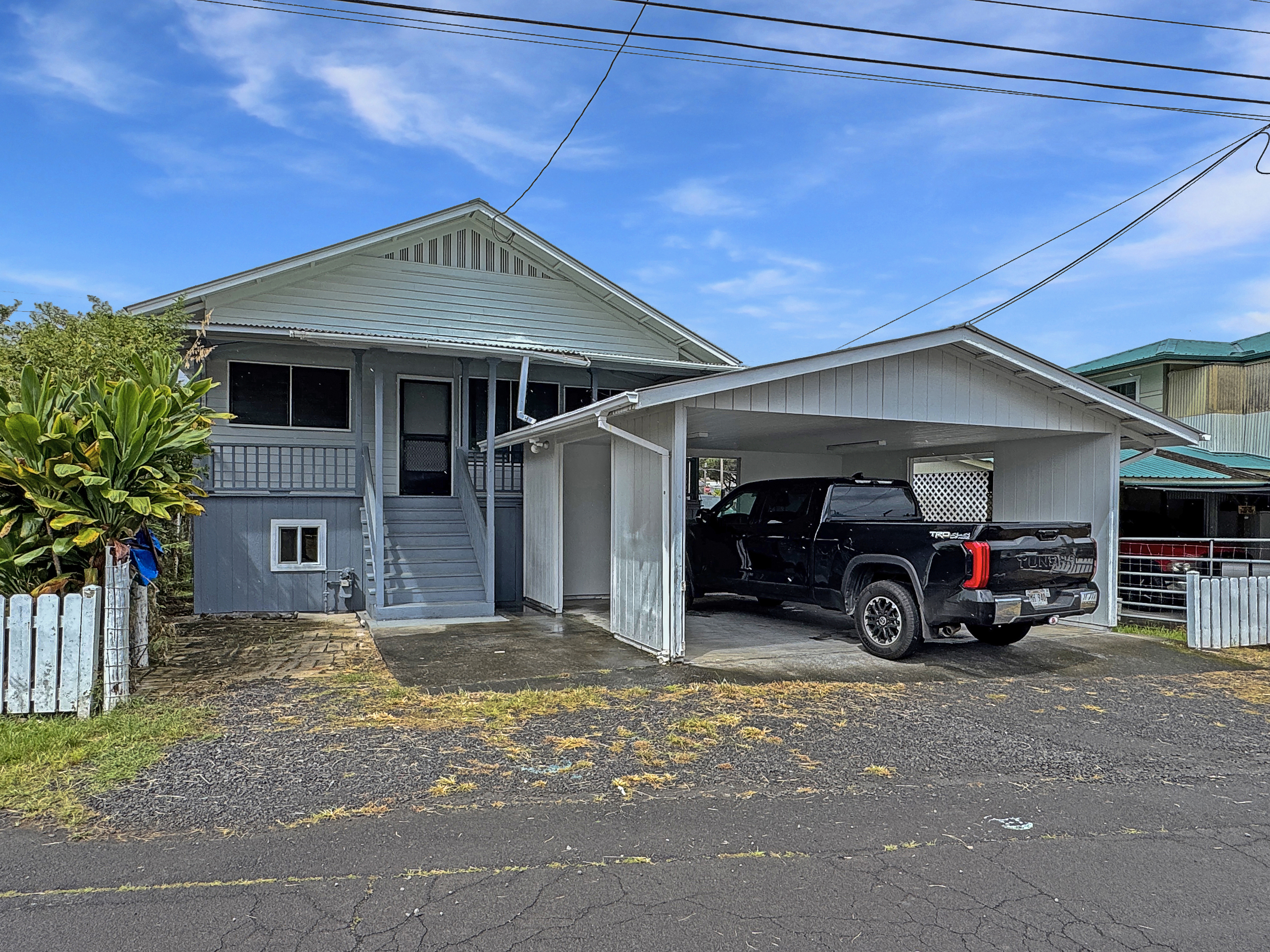 a view of a car in front of garage