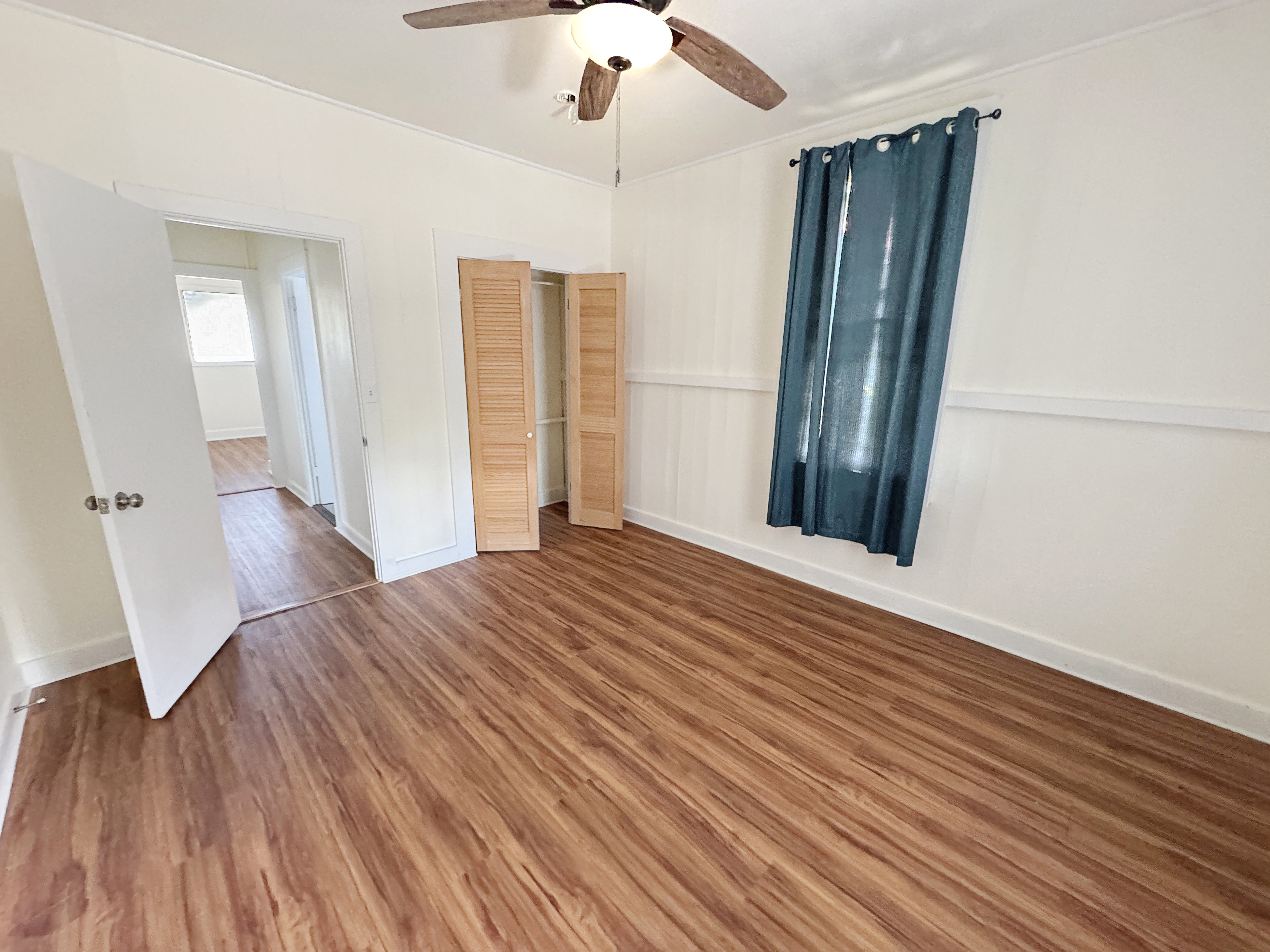 136 Mauna Loa Street Hilo, HI 96720 - Photo 11 of 23 a view of a room with wooden floor and staircase