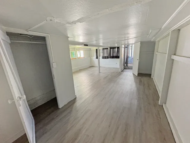 a view of entryway with stairs and wooden floor
