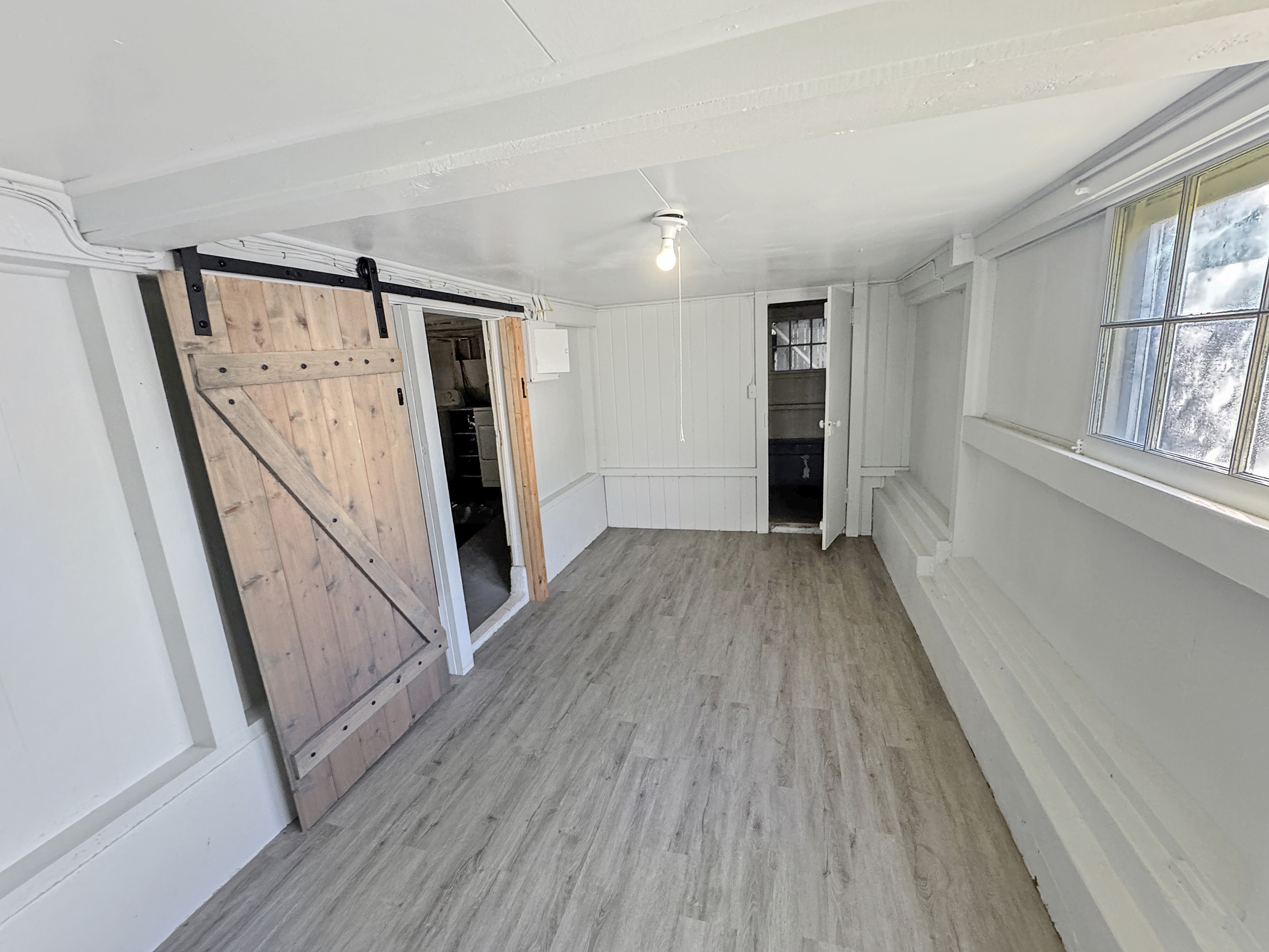 136 Mauna Loa Street Hilo, HI 96720 - Photo 15 of 23 wooden floor in an empty room with a window
