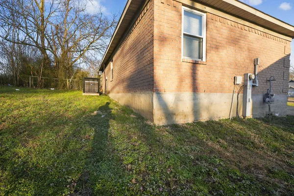 a view of a backyard of the house
