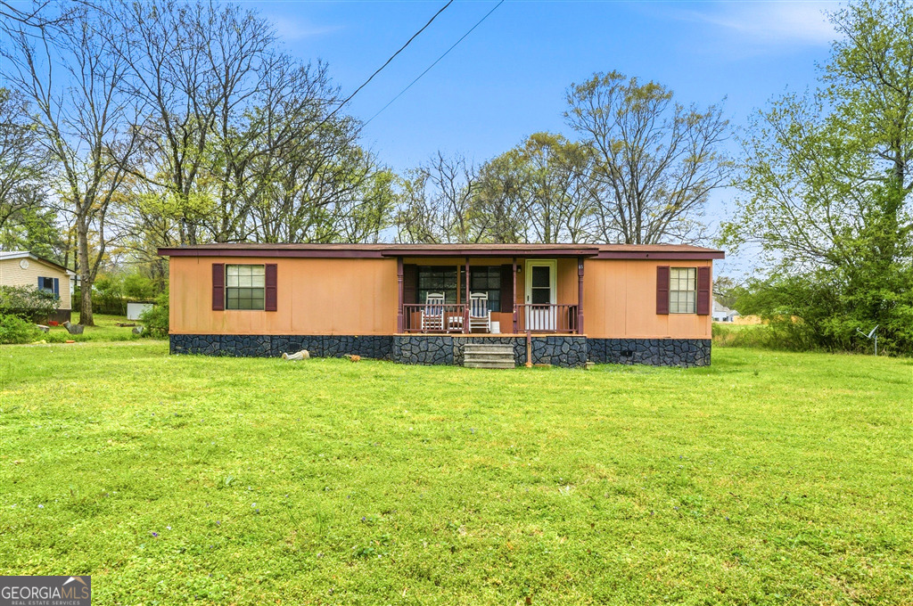 front view of a house with a big yard