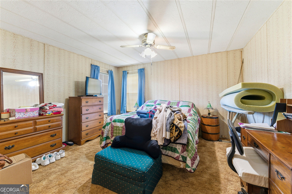 85 Honeysuckle Drive Southwest Cartersville, GA 30120 - Photo 11 of 20 a bedroom with furniture and a bed