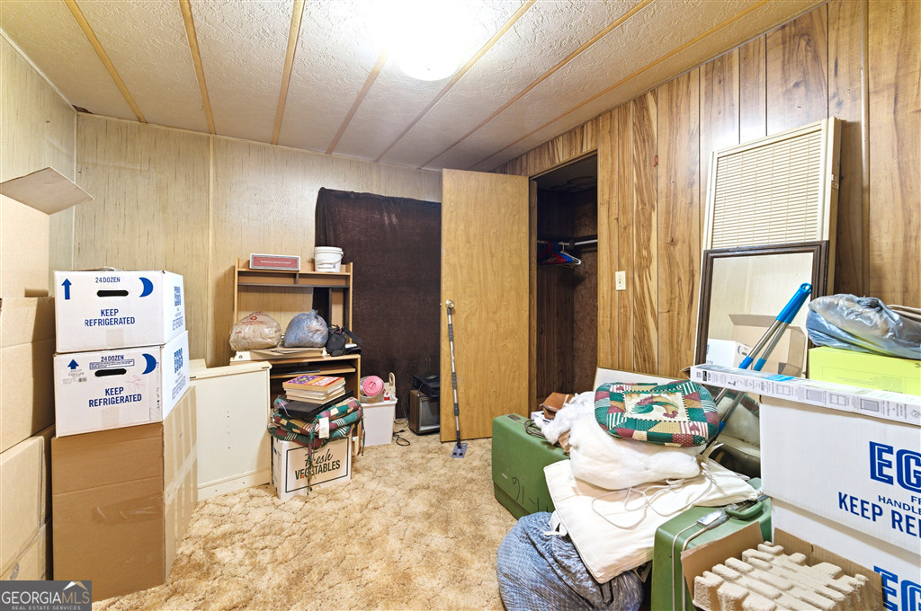 85 Honeysuckle Drive Southwest Cartersville, GA 30120 - Photo 15 of 20 a living room with furniture and a flat screen tv