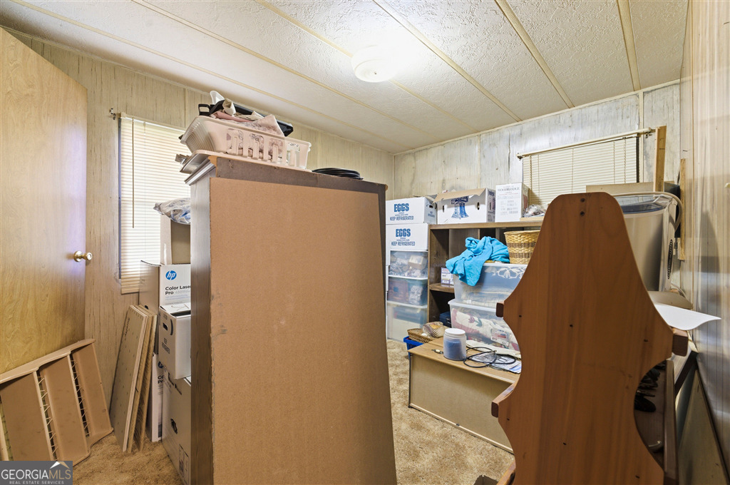 85 Honeysuckle Drive Southwest Cartersville, GA 30120 - Photo 16 of 20 a dining room with furniture and a chandelier