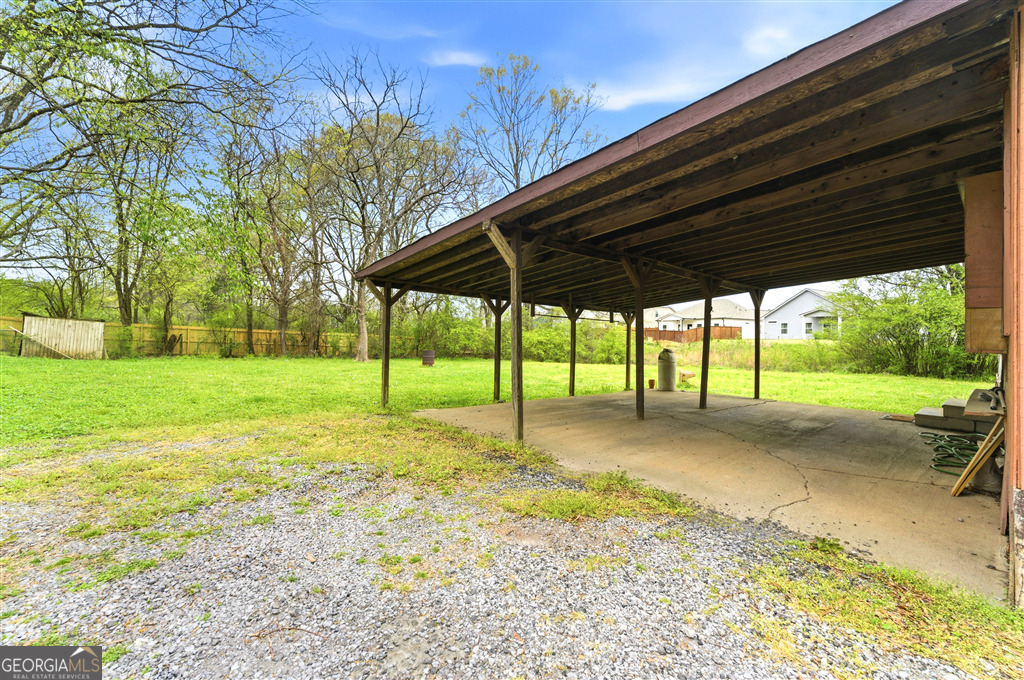 85 Honeysuckle Drive Southwest Cartersville, GA 30120 - Photo 18 of 20 a view of a house with backyard and a area