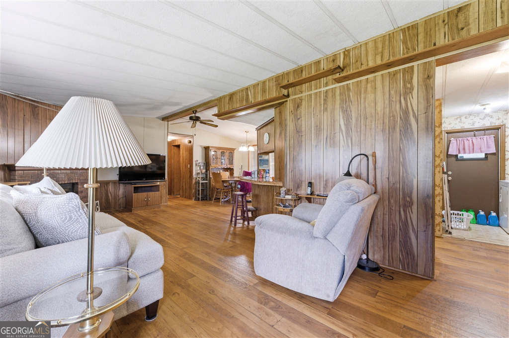85 Honeysuckle Drive Southwest Cartersville, GA 30120 - Photo 4 of 20 a living room with furniture and a wooden floor