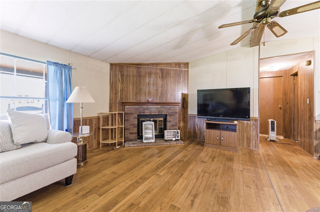 85 Honeysuckle Drive Southwest Cartersville, GA 30120 - Photo 5 of 20 a living room with furniture and a flat screen tv