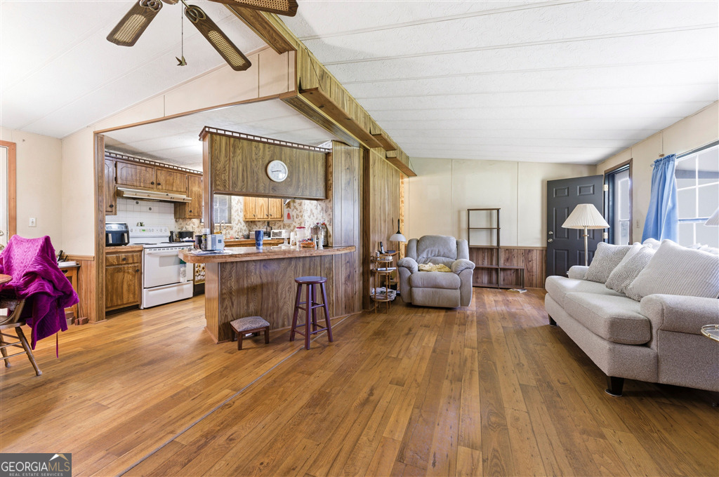 85 Honeysuckle Drive Southwest Cartersville, GA 30120 - Photo 6 of 20 a living room with furniture and a wooden floor