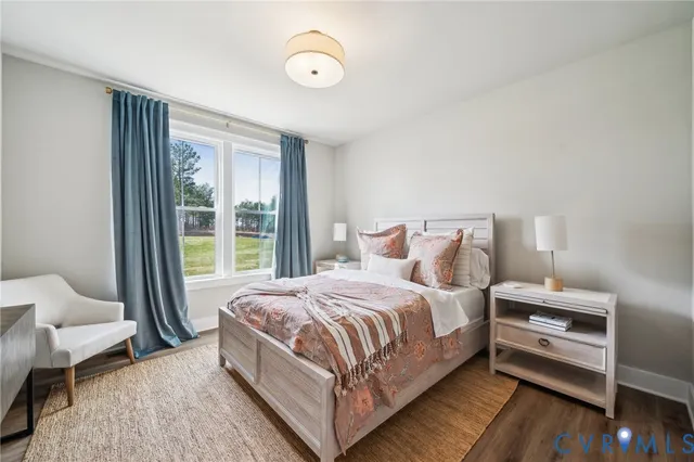 a living room with furniture dining table and a large window